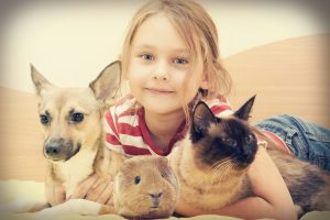 young girl with her dog, cat & pet guinea pig